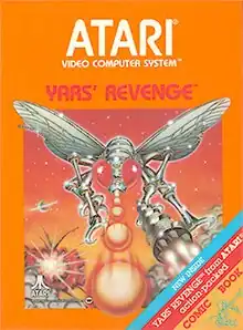 Artwork of a orange, vertical rectangular box. The top half reads "Atari Video Computer System" and below "Yars' Revenge". The bottom half displays a drawn image of a silver robotic fly in battle. On the bottom-right corner there is a tricolor ribbon that says, "New inside. Yars' Revenge from Atari action-packed comic book".