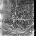 An aerial photo of Bangil and Melaten roads in 1947, also shows Bangil railway station (bottom) before being rebuilt with its warehouse, loops, siding to the locomotive depot, turntable and line to "Kantjil Mas" (Kancil Mas) Textile Factory (ex-Sumber Redjo sugar mill) then a branch line of Modjokerto Steam Tram Co. to Pandaan-Japanan (bottom middle-left).