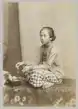 A Javanese woman preparing betel leaf, c. 1880.