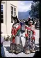 Coronation of King in April 1965. Princess, sister of the King of Sikkim, standing on right, in traditional royal dress, during coronation of King, Gangtok, Sikkim.